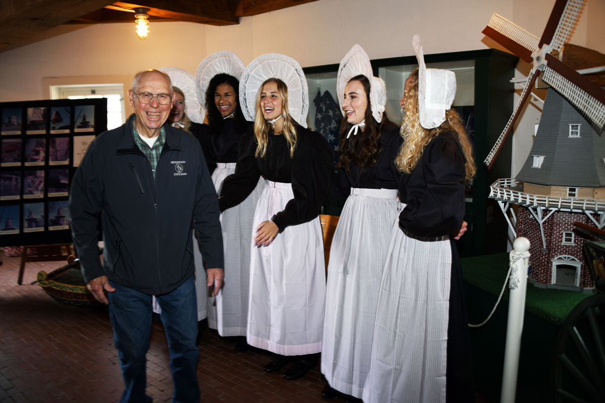 186 Queen Olivia, center, and her attendants greet Arvid Janzen.JPG